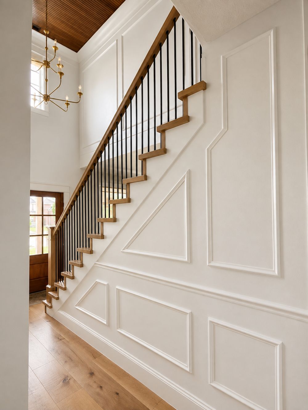 Custom staircase millwork and wainscoting by Big Rig Construction